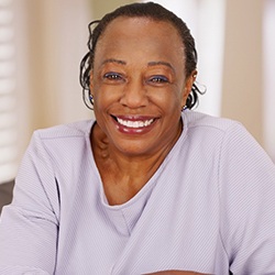 smiling woman with dental implants in Lisle