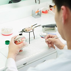 A dental technician making dentures