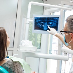 Dentist explaining how dental implants work in Lisle