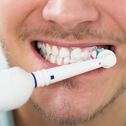 Man brushing teeth