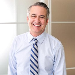 Smiling man in dress shirt and tie