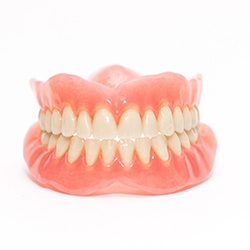 Full set of dentures with a white background