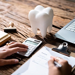 A patient filling out a dental insurance form