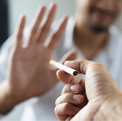 a man saying no to smoking a cigarette