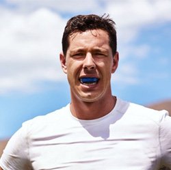a man wearing mouthguards to protect his smile