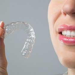 Patient placing clear aligner