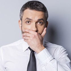 Man covering his mouth