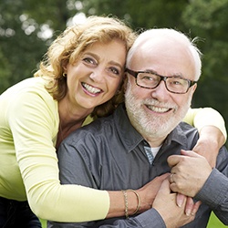 Smiling older couple outdoors