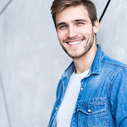 Man with an attractive smile after getting veneers.