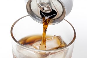 Soda being poured into a glass