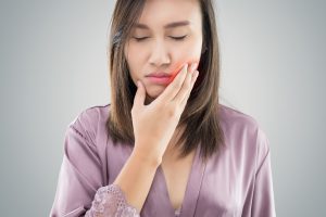 woman with mouth pain