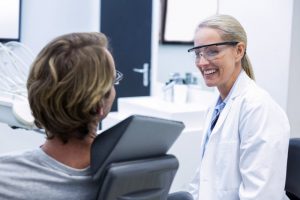 patient speaking to dentist