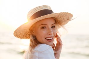 Woman enjoying sun after seeing dentist in Lisle.