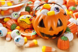 Halloween pail and candy recommended by Lisle dentist