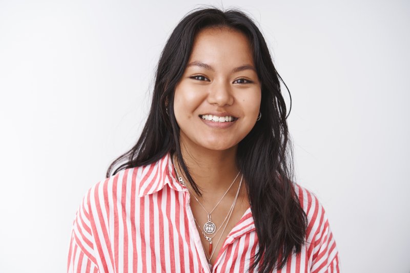 person with dental implants smiling