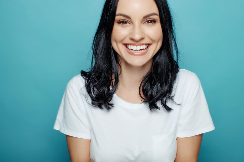 person with dental implants smiling