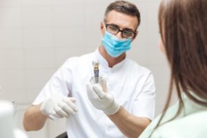 dentist explaining dental implants