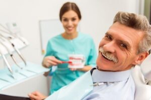 Older man at dentist for dentures