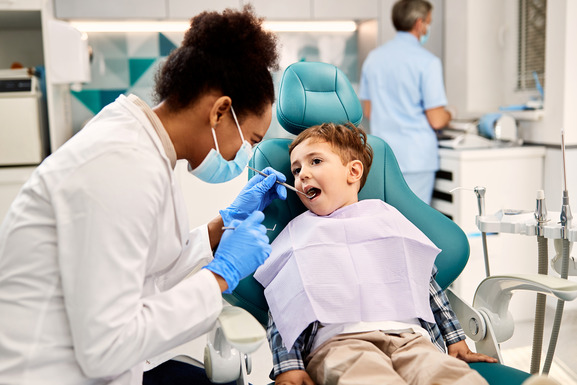 patient smiling while visiting dentist