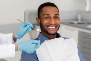Man smiling at his dental visit